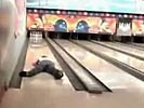 Narcoleptic bowler es out on the bowling alley. 	